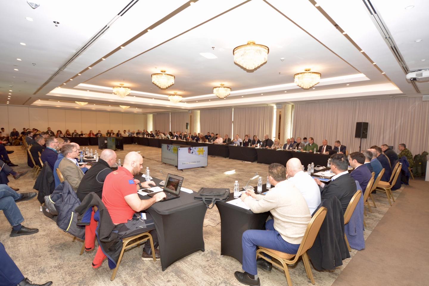 Delegates seated around the plenary conference table at the NATO EADRCC Lessons Identified Conference in Sofia